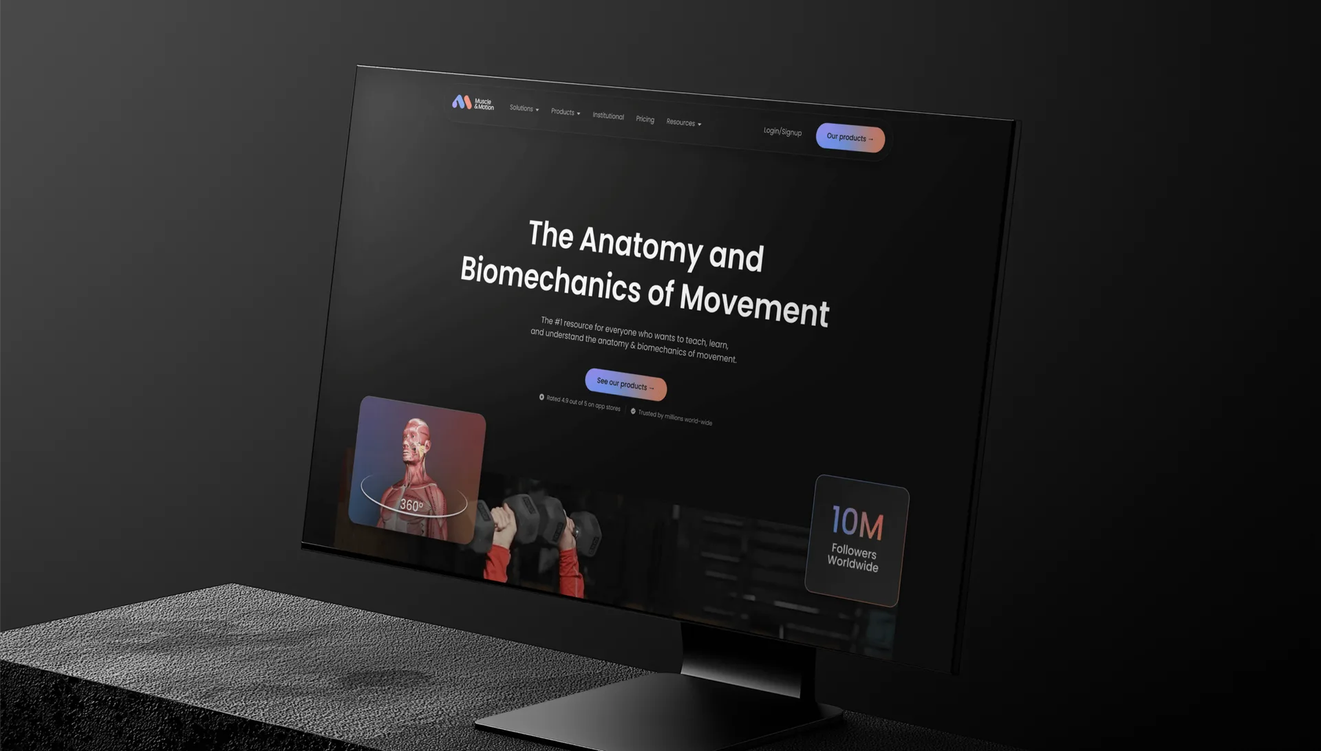Muscle & Motion website displayed on a desktop monitor